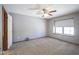 Bedroom with carpet, a ceiling fan, and natural light from the window at 10953 Mount Vernon N Trl, Indianapolis, IN 46229