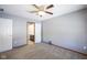 Spacious bedroom with neutral walls and a view into the en-suite bathroom at 10953 Mount Vernon N Trl, Indianapolis, IN 46229