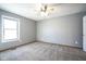 Bedroom with a window and neutral carpeting at 10953 Mount Vernon N Trl, Indianapolis, IN 46229