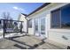 Back exterior featuring a porch swing, sliding glass doors and snow covered yard at 10953 Mount Vernon N Trl, Indianapolis, IN 46229