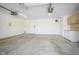 Spacious garage with painted concrete floor and white cabinets at 10953 Mount Vernon N Trl, Indianapolis, IN 46229