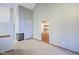 Bright living room with a fireplace, built-in shelving, and neutral paint at 10953 Mount Vernon N Trl, Indianapolis, IN 46229