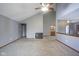 Large living room featuring a fireplace, vaulted ceiling, and neutral carpet at 10953 Mount Vernon N Trl, Indianapolis, IN 46229
