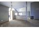 Spacious living room with high ceilings, carpet floors, and a cozy fireplace at 10953 Mount Vernon N Trl, Indianapolis, IN 46229