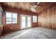 Wood paneled sunroom with lots of windows and double doors at 10953 Mount Vernon N Trl, Indianapolis, IN 46229