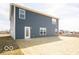 Exterior image of the home highlighting the backyard and clean, vinyl siding at 11322 N Quillow Way, Monrovia, IN 46157