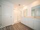 Bathroom with double sinks, vanity, shower and wood-look flooring at 11322 N Quillow Way, Monrovia, IN 46157