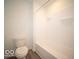 Bathroom with a clean, white bathtub and shower combination with modern fixtures at 11322 N Quillow Way, Monrovia, IN 46157