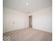 Bedroom with double door closet and neutral carpet at 11322 N Quillow Way, Monrovia, IN 46157