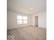 Neutral bedroom featuring carpet, a window, and a closet at 11322 N Quillow Way, Monrovia, IN 46157