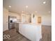 Spacious kitchen with stainless steel appliances, a large island, and ample cabinet space at 11322 N Quillow Way, Monrovia, IN 46157