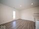 Open space with modern floor plan provides access to exterior door and kitchen area at 11322 N Quillow Way, Monrovia, IN 46157