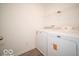 Laundry room featuring white washer and dryer at 11322 N Quillow Way, Monrovia, IN 46157