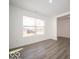 Spacious, bright living area with neutral tones, light floors, and a large window at 11322 N Quillow Way, Monrovia, IN 46157
