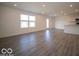 Open-concept area with durable flooring and natural light flowing throughout the space at 11322 N Quillow Way, Monrovia, IN 46157