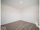 Inviting room with wood-look floors and a neutral color scheme for versatile decorating at 11322 N Quillow Way, Monrovia, IN 46157