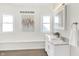 Bright bathroom features double vanity, marble countertop, and large windows at 1339 S East St, Indianapolis, IN 46225