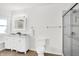 Bright bathroom features double vanity, marble countertop, shower, and toilet at 1339 S East St, Indianapolis, IN 46225