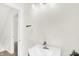 Bathroom with single sink, white fixtures, and a light color scheme at 1339 S East St, Indianapolis, IN 46225