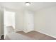 This bedroom's neutral carpet and white walls are enhanced by an open doorway, creating an inviting, airy space at 1339 S East St, Indianapolis, IN 46225