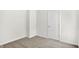 Bedroom featuring neutral carpet, and white door at 1339 S East St, Indianapolis, IN 46225