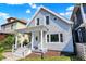 Charming two-story home with light gray siding, a welcoming front porch, and a well-maintained yard at 1339 S East St, Indianapolis, IN 46225