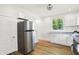 Bright kitchen features white cabinets, stainless appliances, and natural light at 1339 S East St, Indianapolis, IN 46225