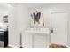 Convenient laundry area near kitchen with white washer and dryer at 1339 S East St, Indianapolis, IN 46225