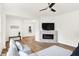Bright living room with hardwood floors, a fireplace, contemporary furniture, and stylish decor at 1339 S East St, Indianapolis, IN 46225