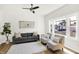 Bright living room with hardwood floors, large windows, modern furniture, and stylish decor at 1339 S East St, Indianapolis, IN 46225