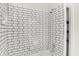 Close up of white subway tile shower with chrome fixtures at 1339 S East St, Indianapolis, IN 46225