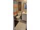 Bathroom features a white vanity and a toilet with colorful shower curtain at 193 Sugarwood Ln, Avon, IN 46123