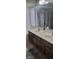 Bathroom features a double sink vanity with mosaic tile backsplash at 193 Sugarwood Ln, Avon, IN 46123