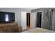 Bedroom with neutral walls, a comfortable bed, and an adjacent bathroom at 193 Sugarwood Ln, Avon, IN 46123
