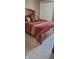 Bedroom with wood-framed bed and closet door at 193 Sugarwood Ln, Avon, IN 46123
