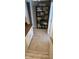 Hallway with carpeted stairs and a shelving unit against the wall at 193 Sugarwood Ln, Avon, IN 46123