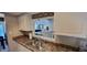 Eat-in kitchen with white cabinetry, and stainless steel sink at 193 Sugarwood Ln, Avon, IN 46123