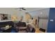 Cozy living room with fireplace, vaulted ceiling, and open staircase at 193 Sugarwood Ln, Avon, IN 46123