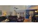 Comfortable living room features vaulted ceilings and neutral walls with a view to the kitchen at 193 Sugarwood Ln, Avon, IN 46123