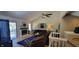 Inviting living room with fireplace, vaulted ceiling, and view of staircase at 193 Sugarwood Ln, Avon, IN 46123