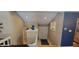 View of stairway to lower level, with blue vase, and view to living area at 193 Sugarwood Ln, Avon, IN 46123