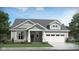 Charming one-story home featuring a two-car garage and classic architectural design with inviting curb appeal at 19726 Highclere Ln, Sheridan, IN 46069