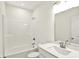 Bright bathroom features a shower/tub combo and a vanity with white countertop at 19726 Highclere Ln, Sheridan, IN 46069