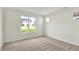 Bright bedroom with tan carpet features a large window with backyard view at 19726 Highclere Ln, Sheridan, IN 46069