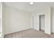 Bedroom with tan carpet features a sliding door closet, recessed light, and window at 19726 Highclere Ln, Sheridan, IN 46069