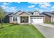 Charming single-story home with a well-manicured lawn and a two-car garage at 19726 Highclere Ln, Sheridan, IN 46069
