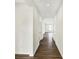 Long hallway featuring clean white walls and modern wood-look flooring at 19726 Highclere Ln, Sheridan, IN 46069
