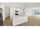 Modern kitchen featuring white cabinetry, stainless steel appliances, and a center island at 19726 Highclere Ln, Sheridan, IN 46069