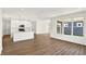 Spacious living area with wood-look floors and large windows for ample natural light at 19726 Highclere Ln, Sheridan, IN 46069