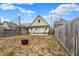 View of backyard featuring a house, patio, firepit, and wood fence at 2709 Jackson St, Indianapolis, IN 46222